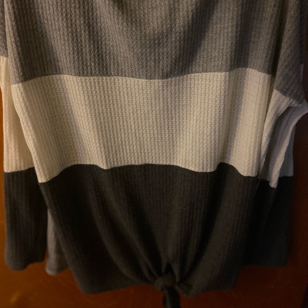 Striped long sleeve large knit shirt. Has a tie in the front